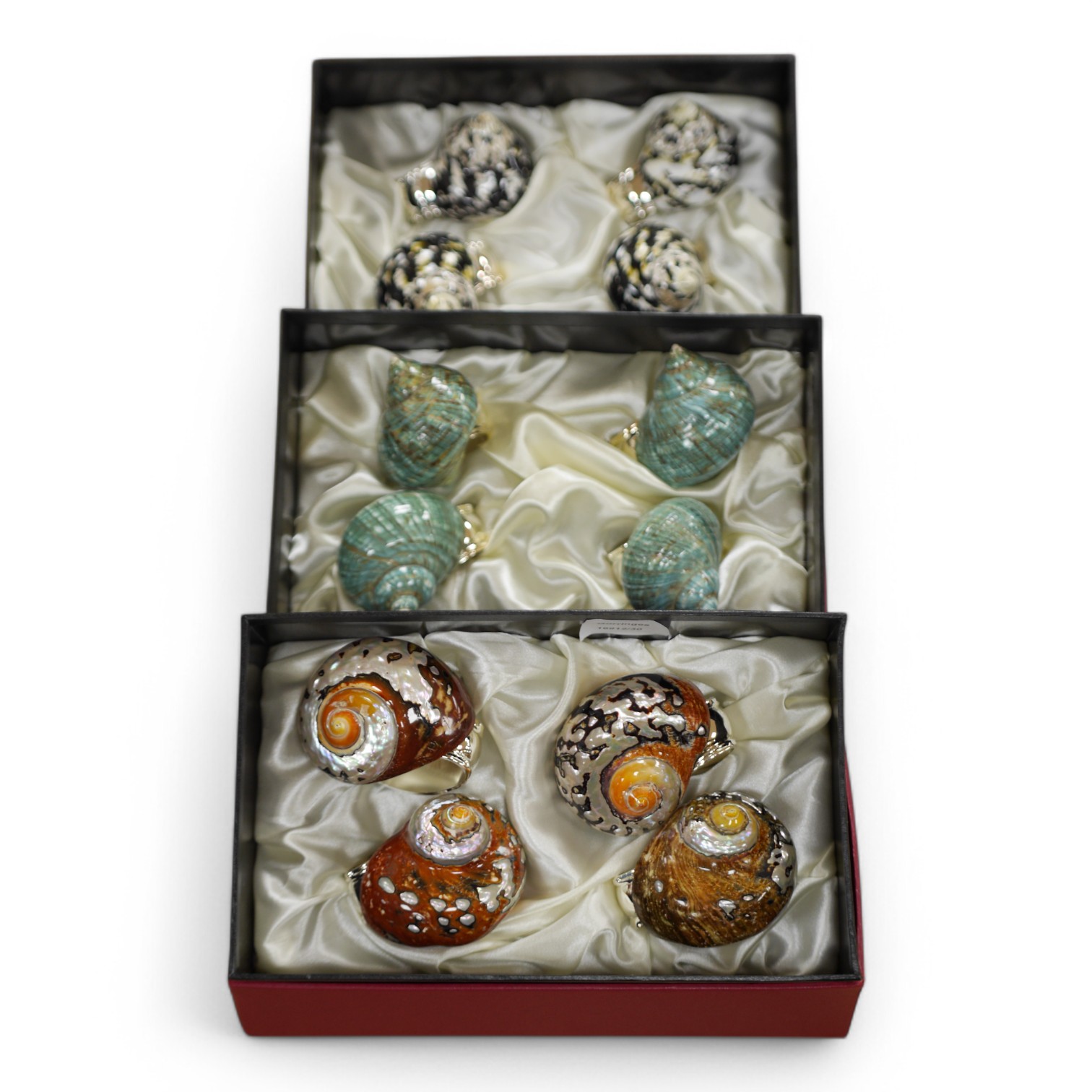 Hans Turnwald, three boxed sets of modernist shell and plated napkin rings in the form of snails. Condition - good